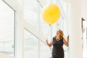 woman holding yellow balloon personal branding photography edmonton