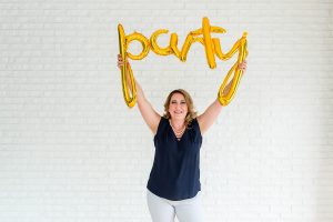 woman holding party sign