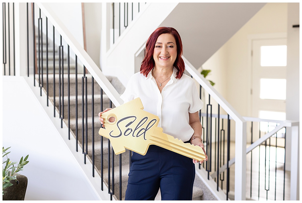 Laura Tosto working during her Edmonton realtor brand photoshoot