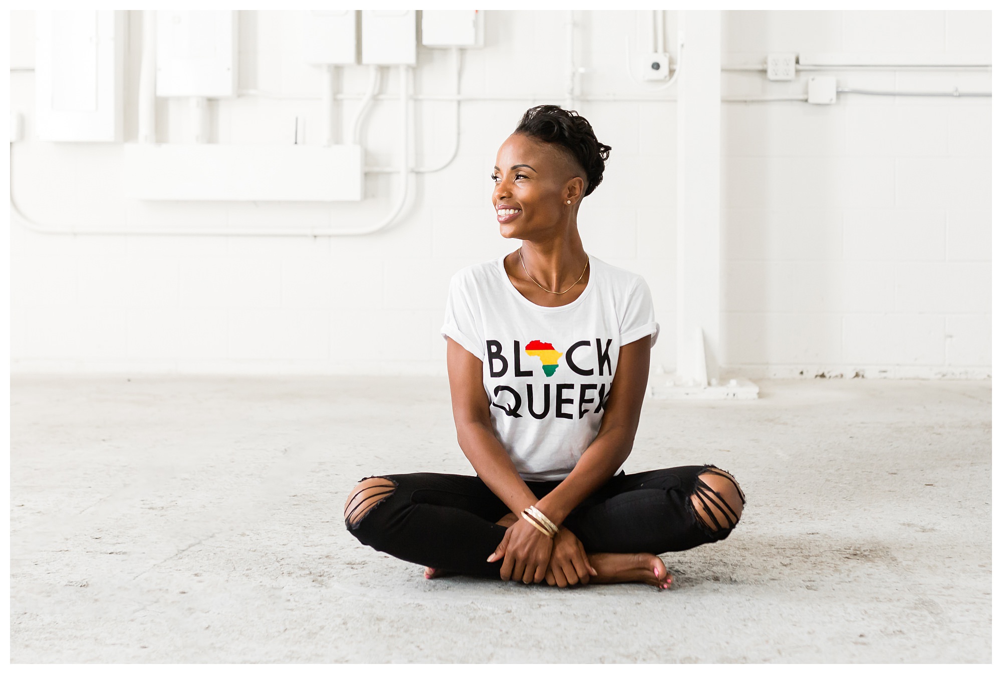 Woman sitting comfortably and smiling during an Edmonton brand photoshoot
